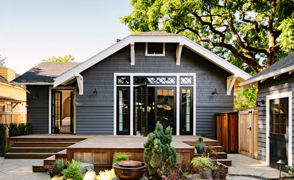 Design ideas for a gey classic bungalow house exterior in Portland with a half-hip roof.