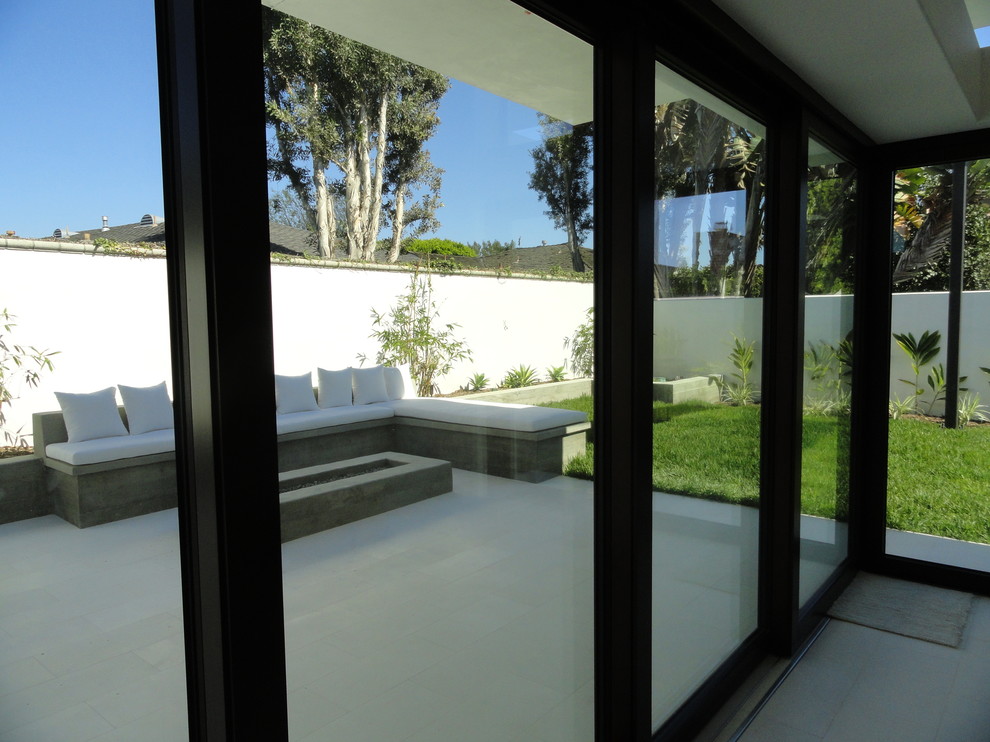 Inspiration for a white modern bungalow render house exterior in Orange County.