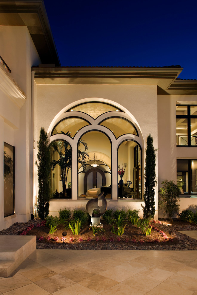 Example of a trendy white exterior home design in Austin