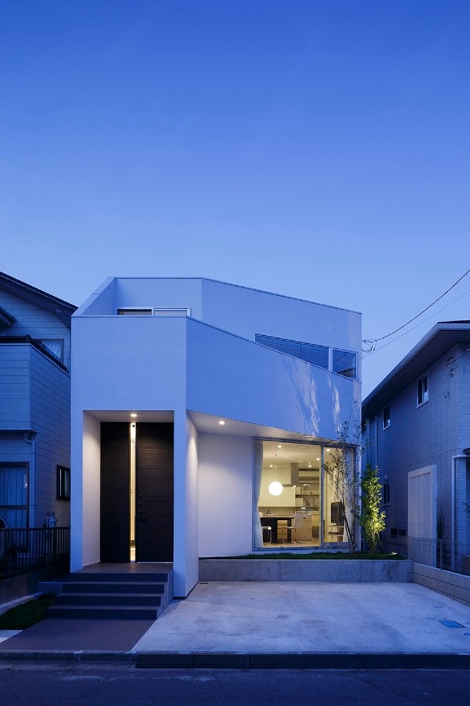 Inspiration for a small and white modern two floor house exterior in Other.