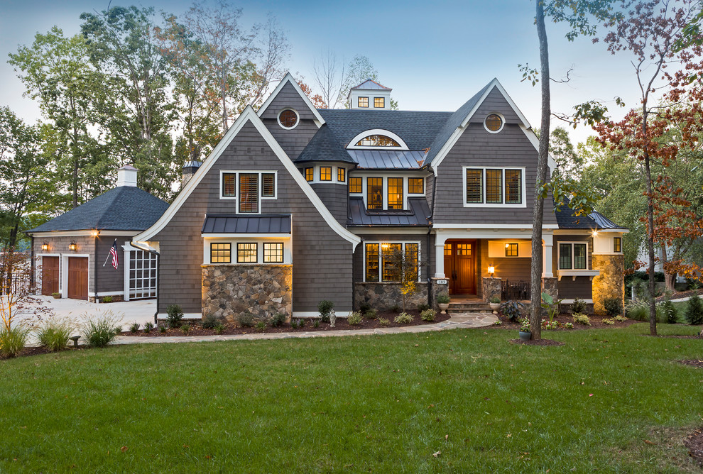 Large elegant gray three-story concrete fiberboard exterior home photo in Charlotte with a mixed material roof