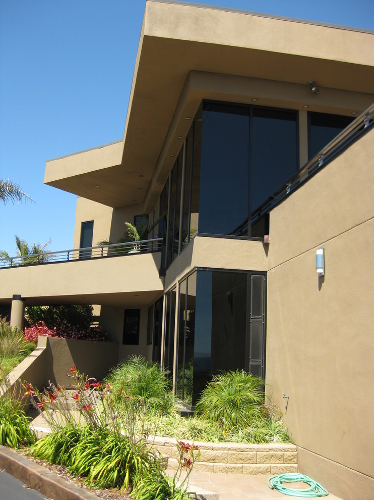 Design ideas for a beige contemporary two floor house exterior in San Luis Obispo.