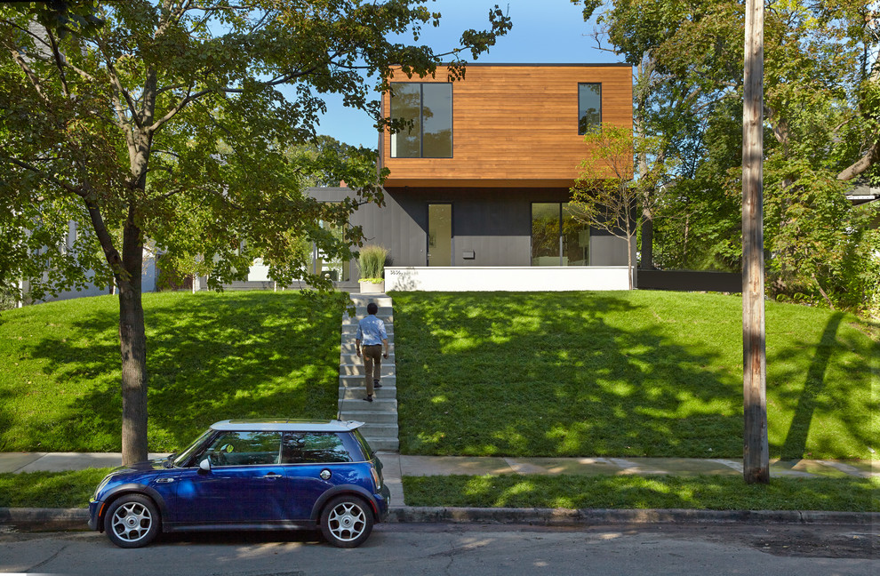 Inspiration for a modern two floor house exterior in Minneapolis.