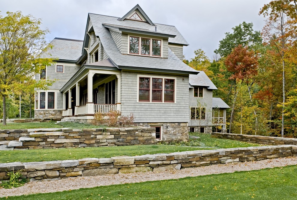 Design ideas for a large victorian two floor house exterior in Burlington with wood cladding.