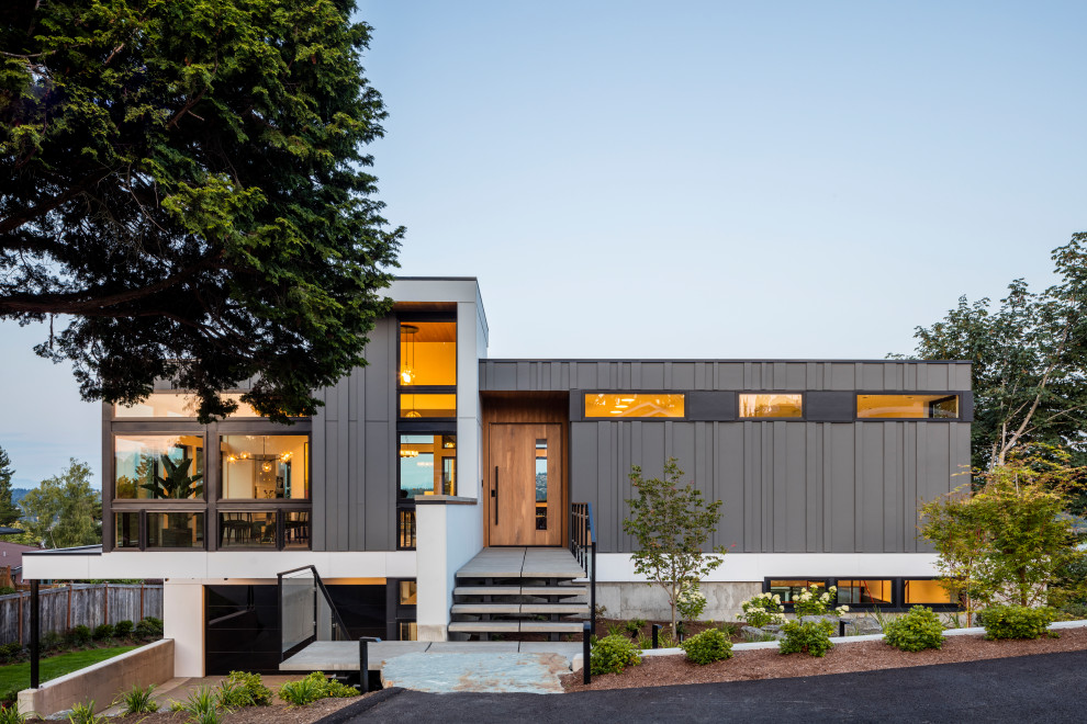 Inspiration for a large modern gray two-story mixed siding exterior home remodel in Seattle