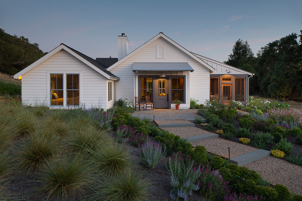 Cottage white one-story gable roof photo in San Francisco