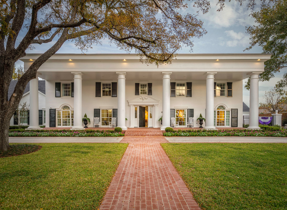 Huge elegant white two-story exterior home photo in Dallas