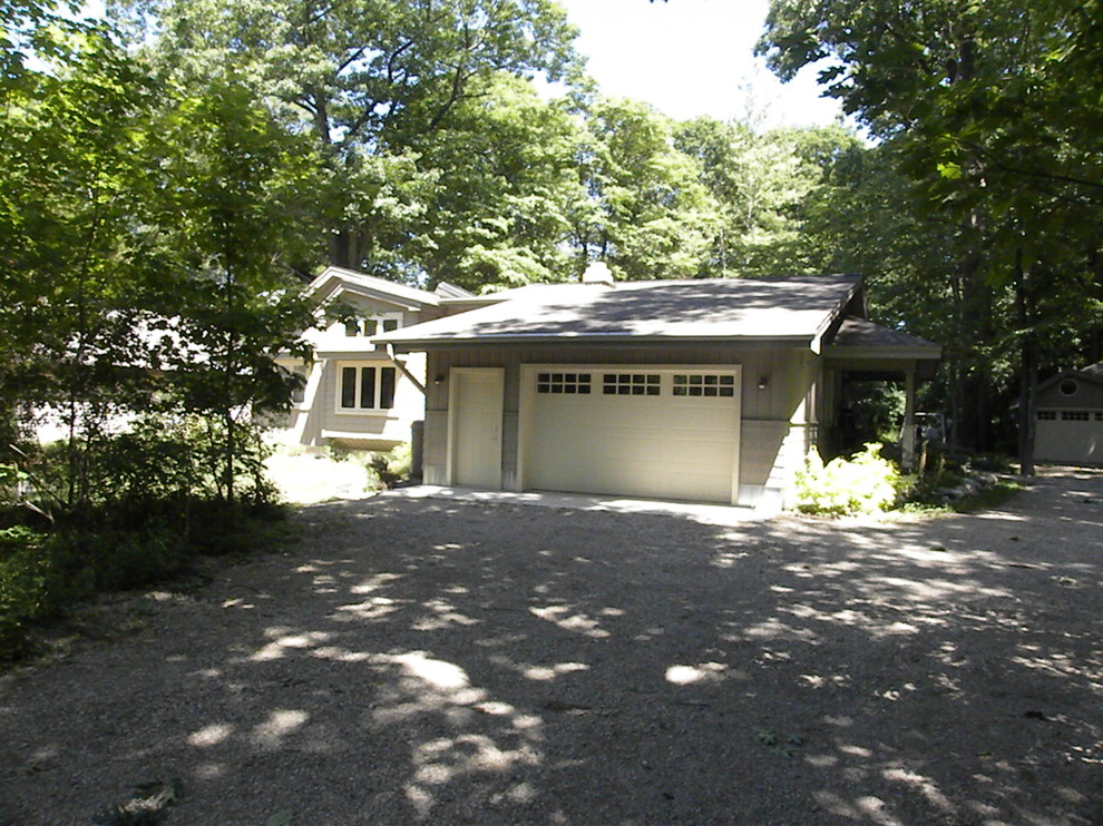 This is an example of a medium sized eclectic garage in Grand Rapids.