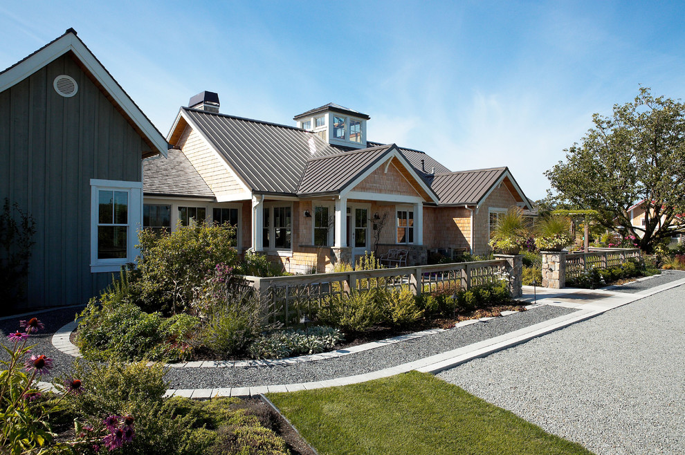 Example of a country wood exterior home design in Seattle