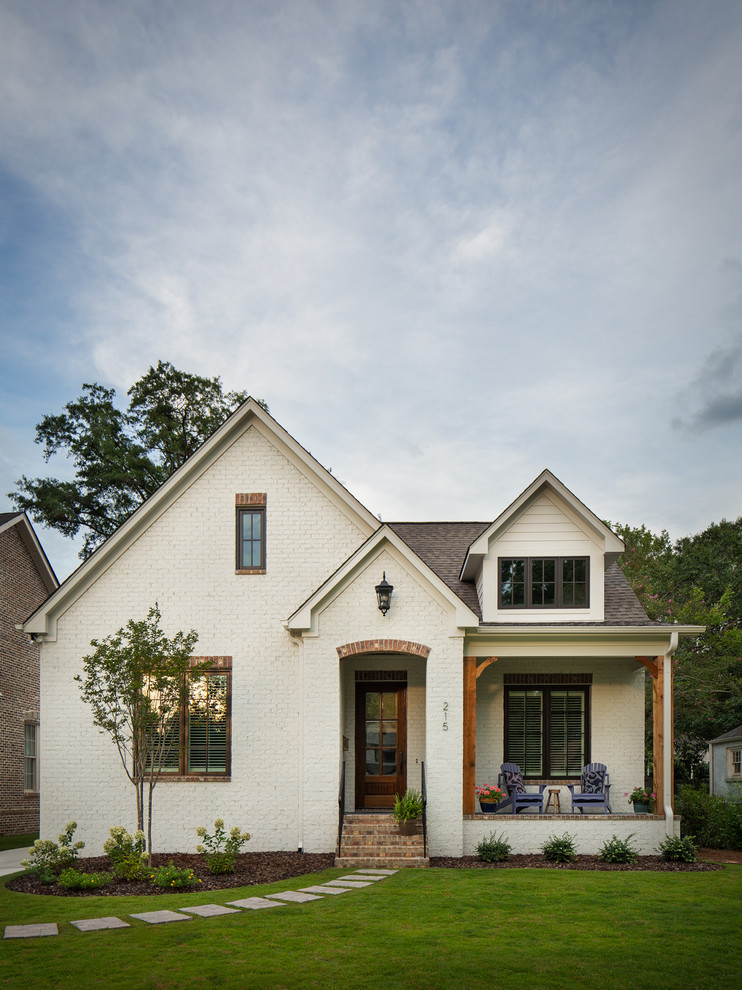 Small elegant white one-story brick exterior home photo in Birmingham with a shingle roof