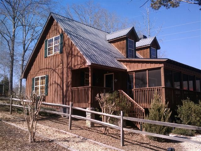 Photo of a medium sized rustic two floor house exterior in Atlanta with mixed cladding.
