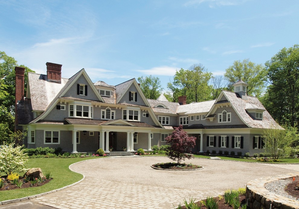 Inspiration for a timeless gray three-story wood exterior home remodel in New York