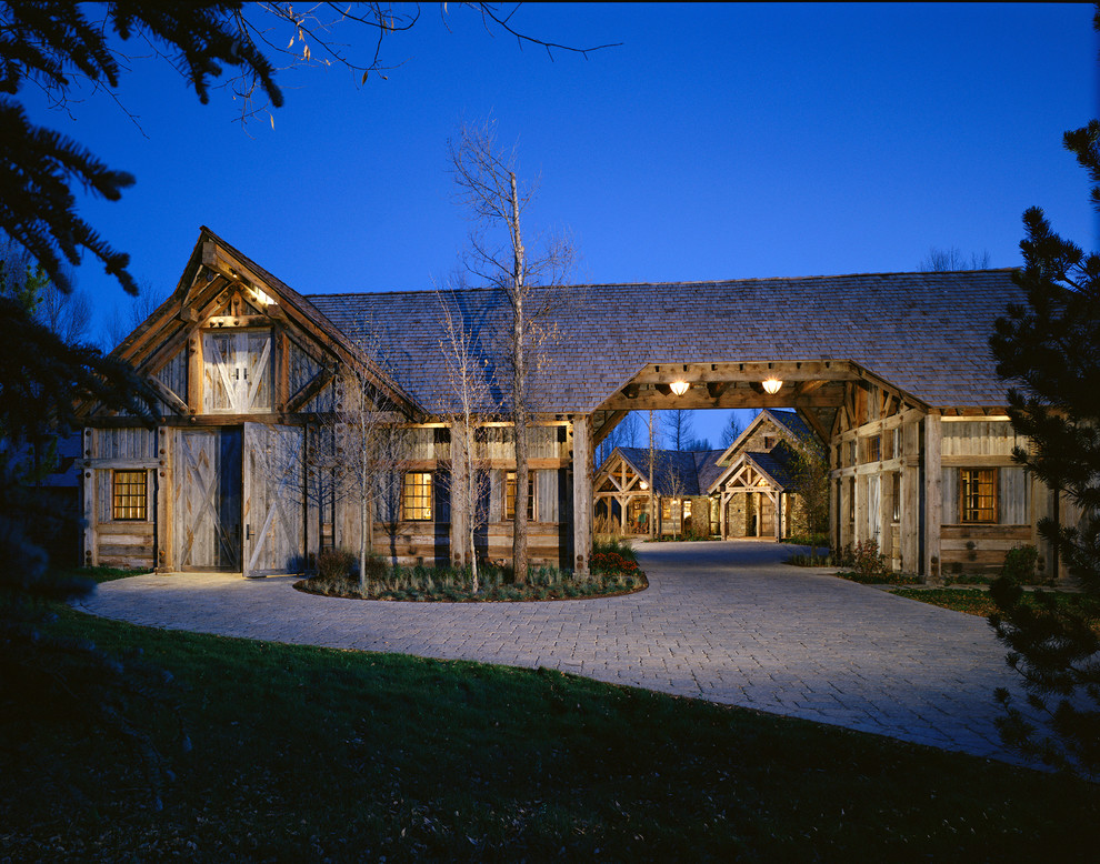 Example of a large mountain style exterior home design in Other