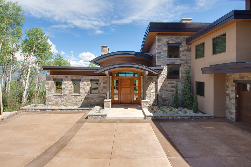 Inspiration for a contemporary two-story mixed siding exterior home remodel in Denver