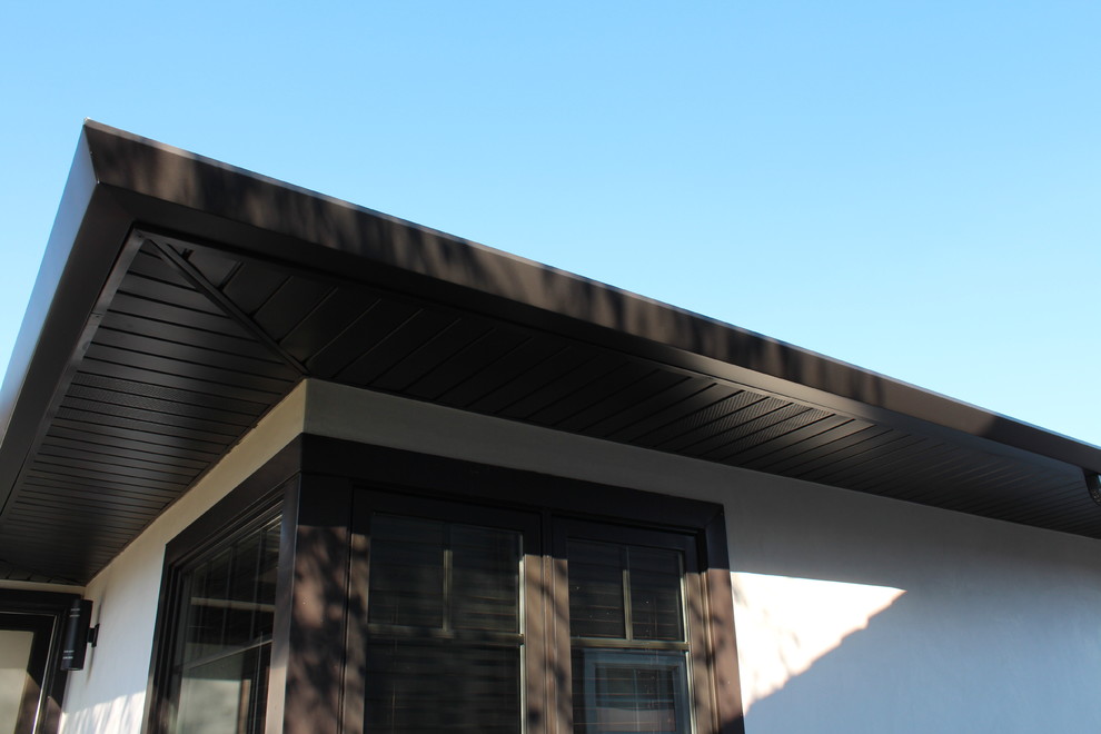 Soffits, Fascia, and Angle Face Gutters in Dark Bronze Aluminum. Long
