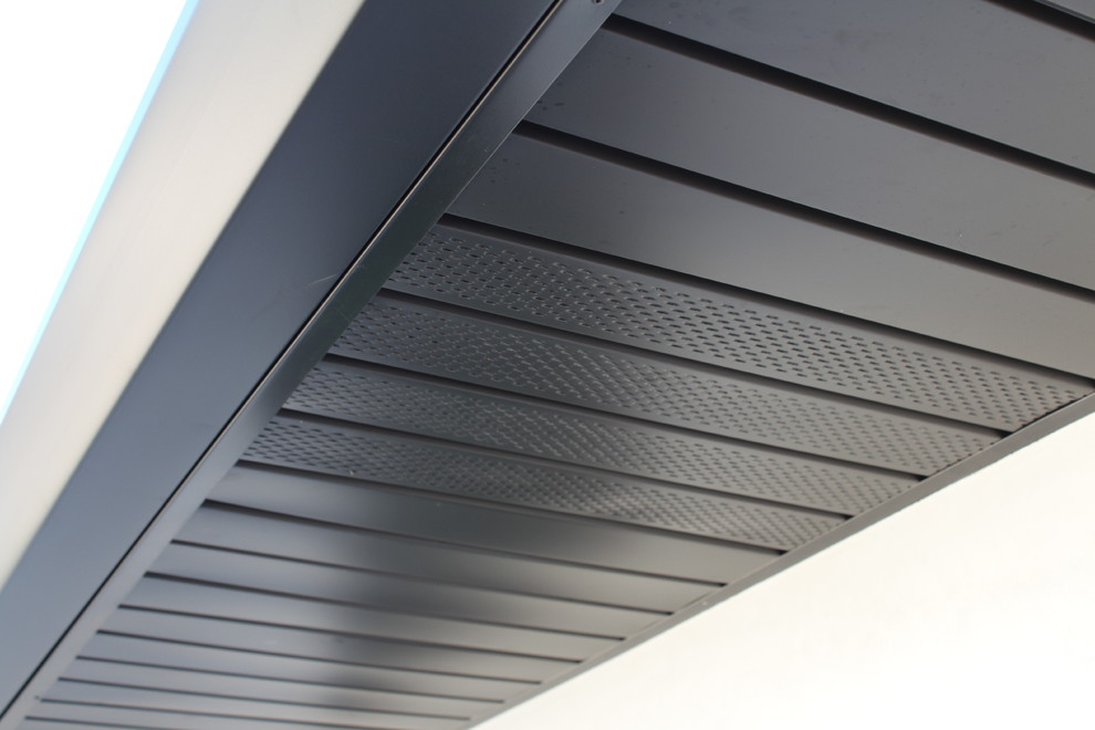 Soffits, Fascia, and Angle Face Gutters in Dark Bronze Aluminum. Long