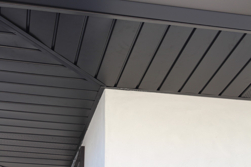 Soffits, Fascia, and Angle Face Gutters in Dark Bronze Aluminum. Long