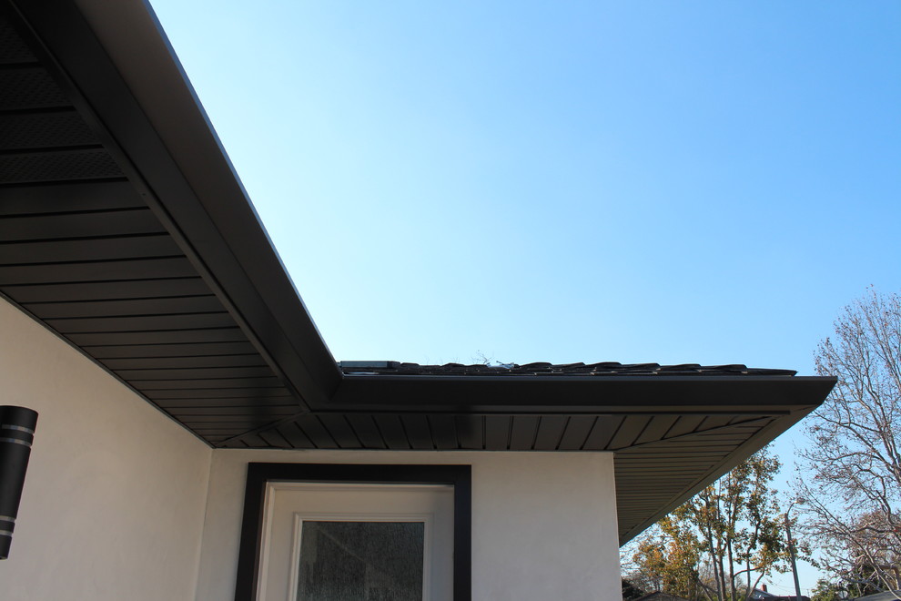 Soffits, Fascia, and Angle Face Gutters in Dark Bronze Aluminum. Long
