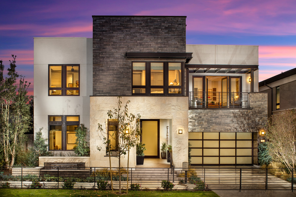 Foto de fachada de casa multicolor contemporánea grande de dos plantas con revestimientos combinados y tejado plano