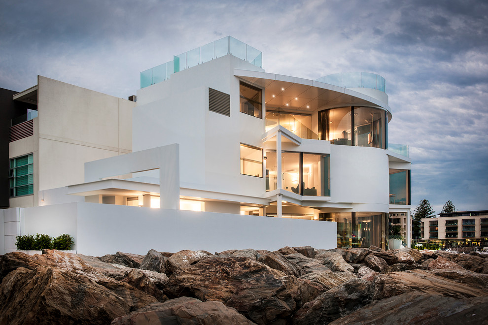 Inspiration for a large and white contemporary house exterior in Adelaide with three floors.