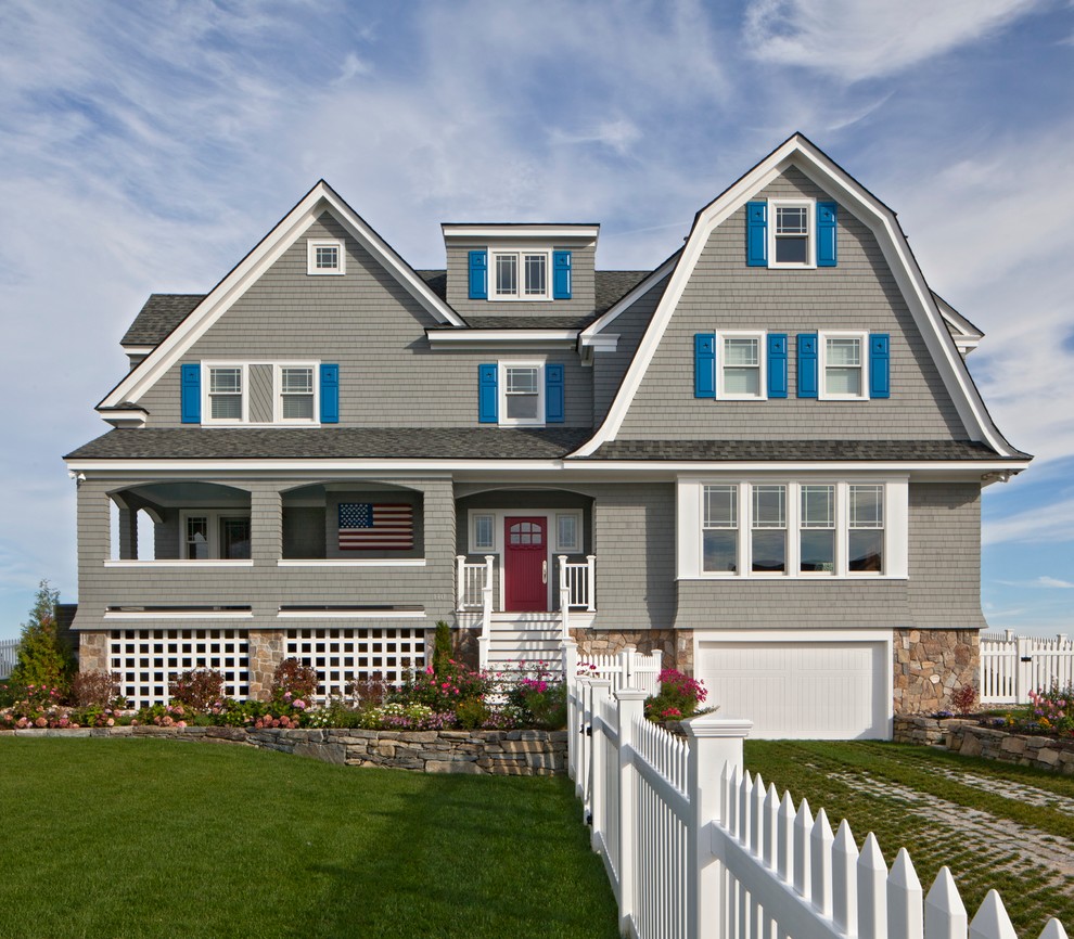 Example of a large beach style gray three-story wood exterior home design in Portland Maine