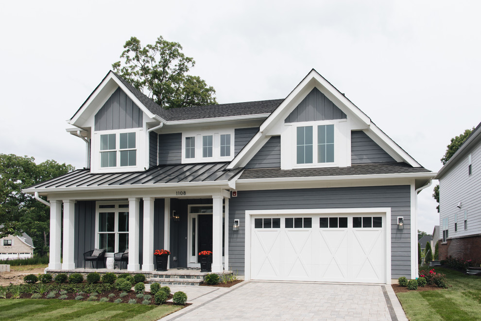 Country gray two-story mixed siding exterior home photo in Chicago with a shingle roof
