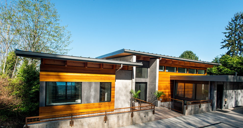Inspiration för moderna bruna hus, med platt tak