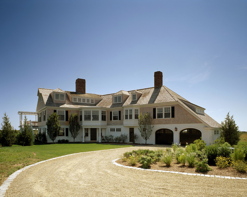 Inspiration for a huge coastal beige three-story wood house exterior remodel in Boston with a shingle roof