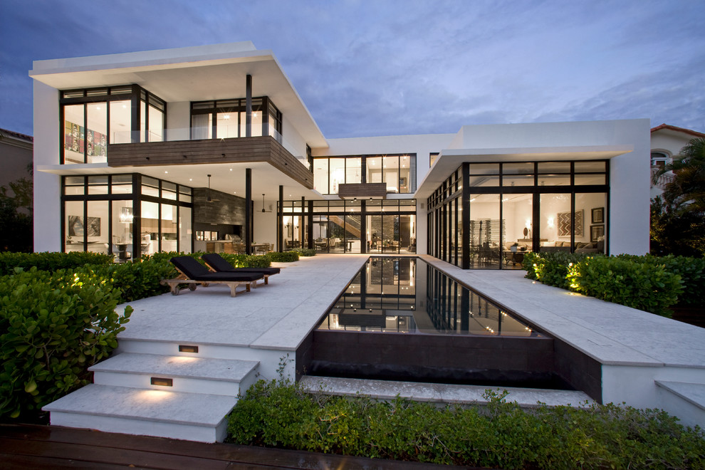 Inspiration for a white contemporary two floor house exterior in Miami.