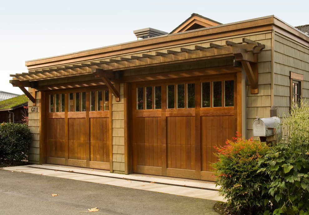 This is an example of a medium sized and beige traditional two floor detached house in Seattle with wood cladding, a pitched roof and a shingle roof.