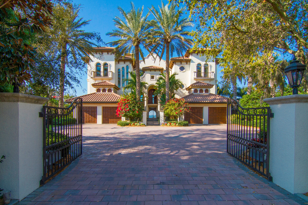 Photo of a large mediterranean semi-detached house in Tampa.