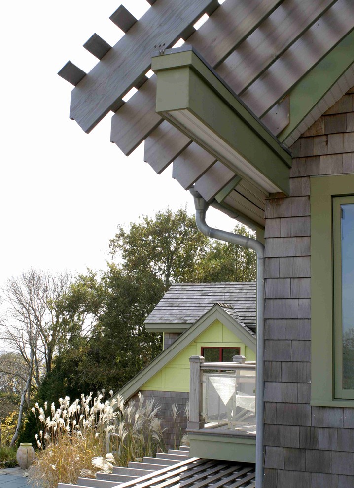 Large elegant green two-story mixed siding gable roof photo in New York