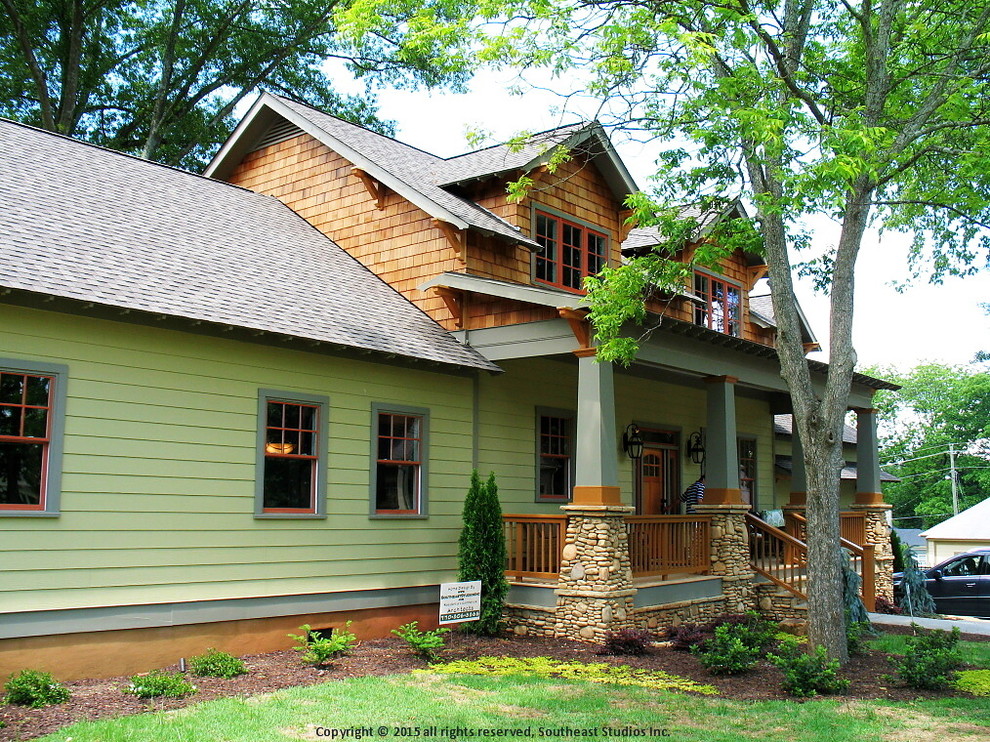 Photo of a medium sized and green traditional two floor house exterior in Atlanta with mixed cladding and a pitched roof.