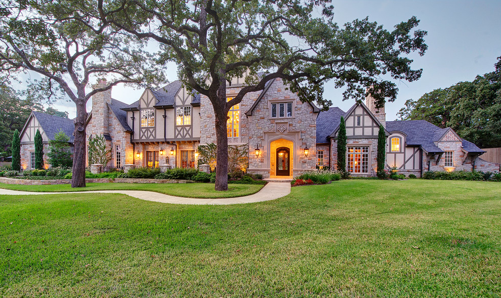 Design ideas for a large traditional two floor brick house exterior in Dallas.