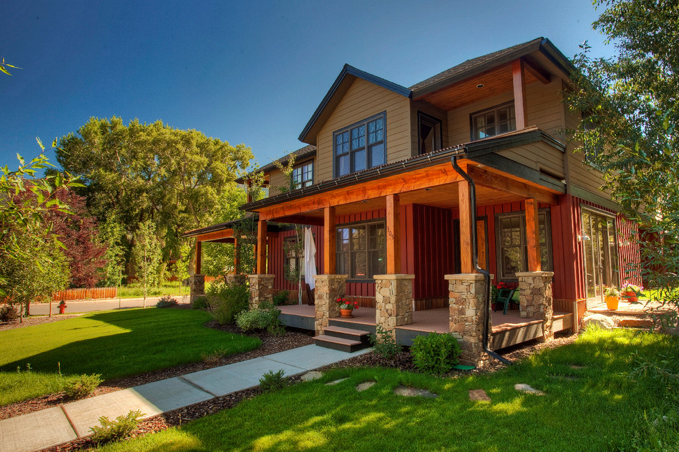 Example of a mid-sized classic red two-story wood house exterior design in Denver with a hip roof and a shingle roof