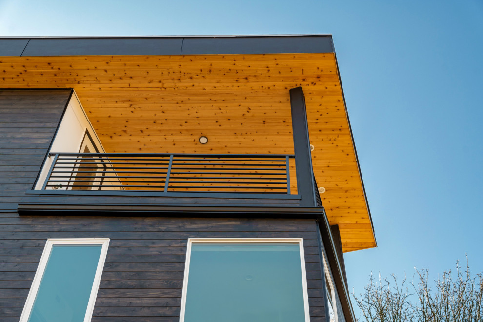 Inspiration pour un façade d'immeuble minimaliste en bois de taille moyenne.