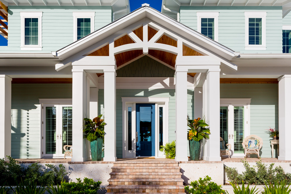 Example of a large island style exterior home design in Tampa