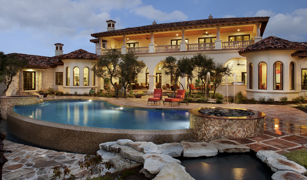Mediterranean two-story exterior home idea in Austin