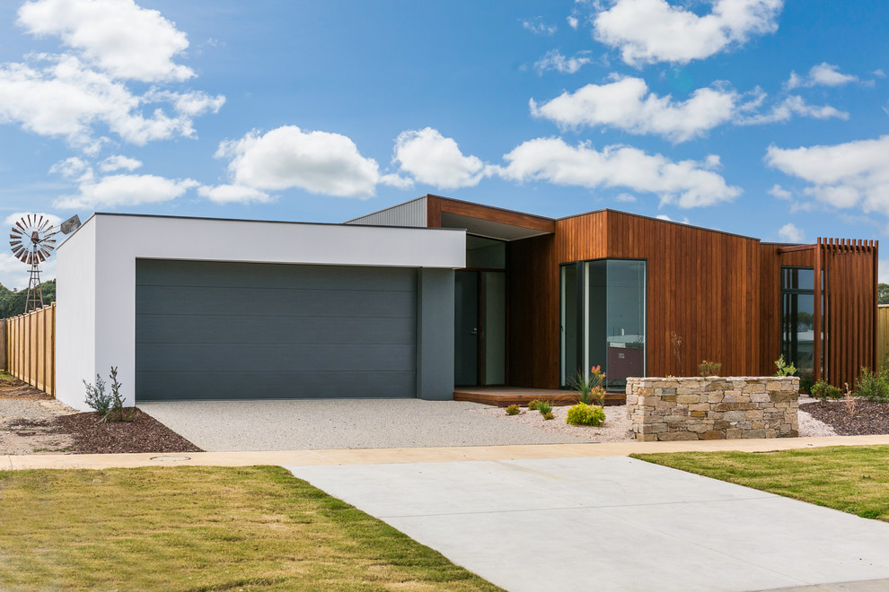 This is an example of a medium sized and multi-coloured contemporary bungalow detached house in Geelong with mixed cladding, a flat roof and a metal roof.