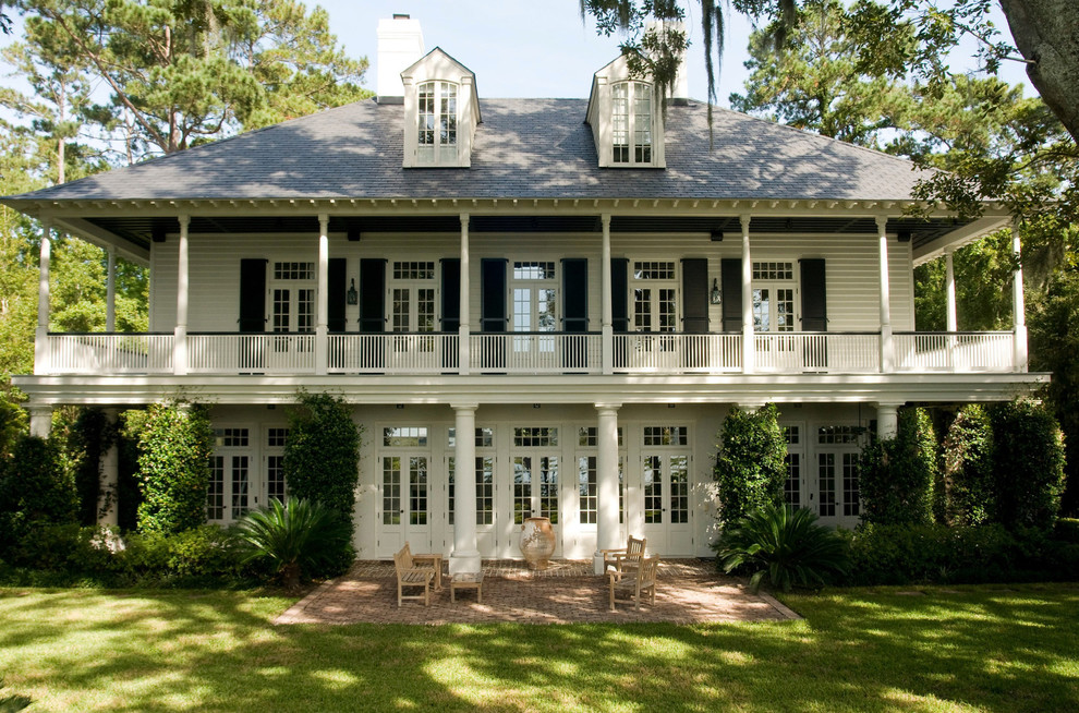 Inspiration for a large timeless white three-story exterior home remodel in Charleston