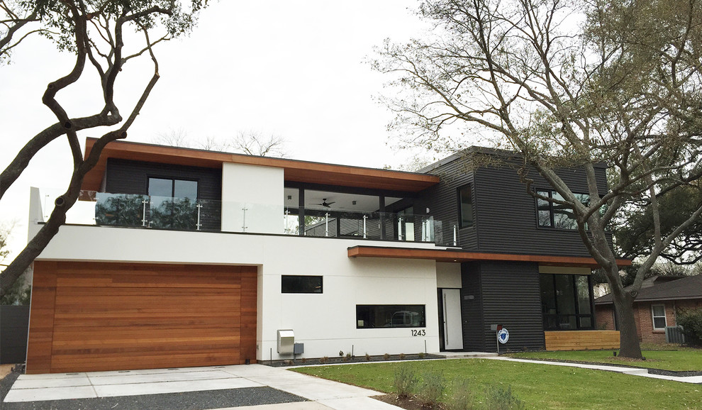 Inspiration for a mid-sized contemporary white two-story metal exterior home remodel in Houston