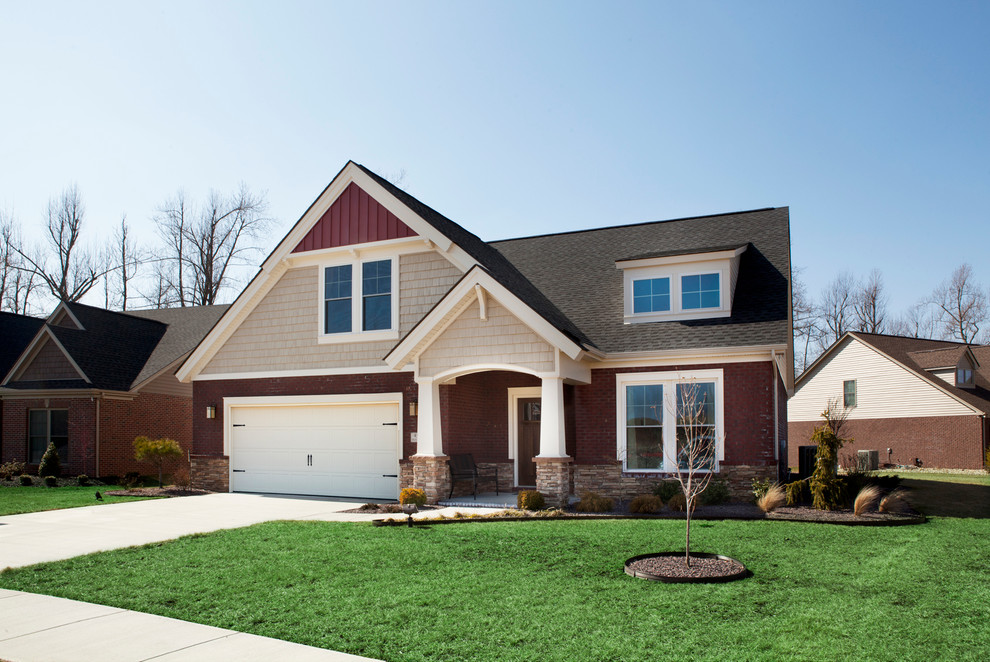 Example of a mid-sized arts and crafts red two-story mixed siding exterior home design in Other