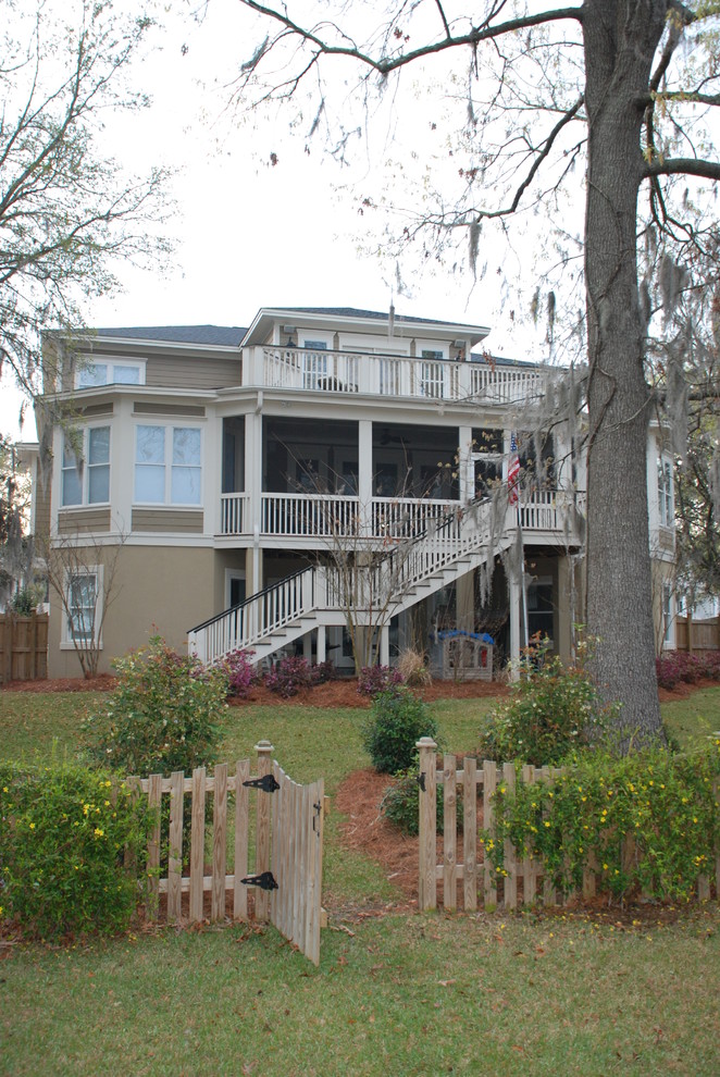Large traditional brown three-story concrete fiberboard exterior home idea in Charleston