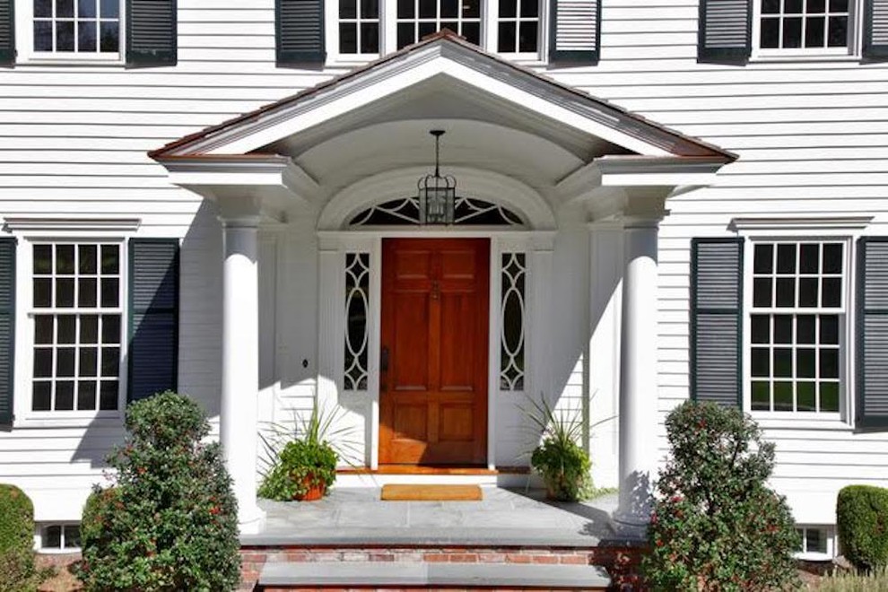 Example of a classic white two-story wood exterior home design in New York
