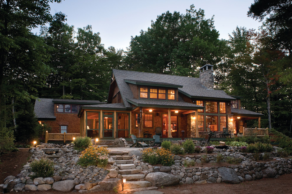 Large rustic brown two-story wood house exterior idea in Boston with a hip roof and a shingle roof