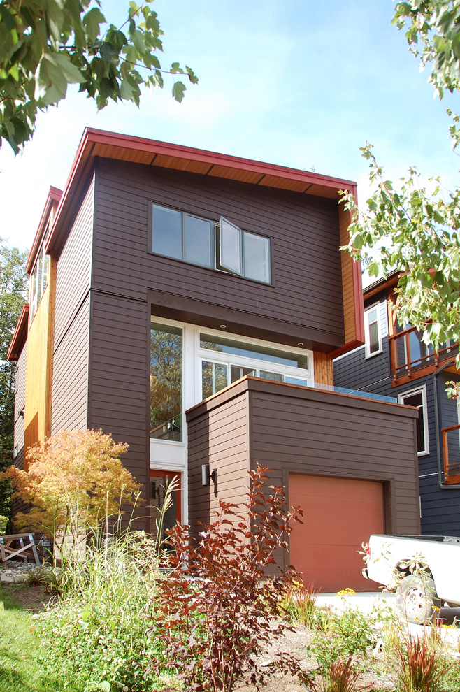 Example of a trendy brown exterior home design in Vancouver