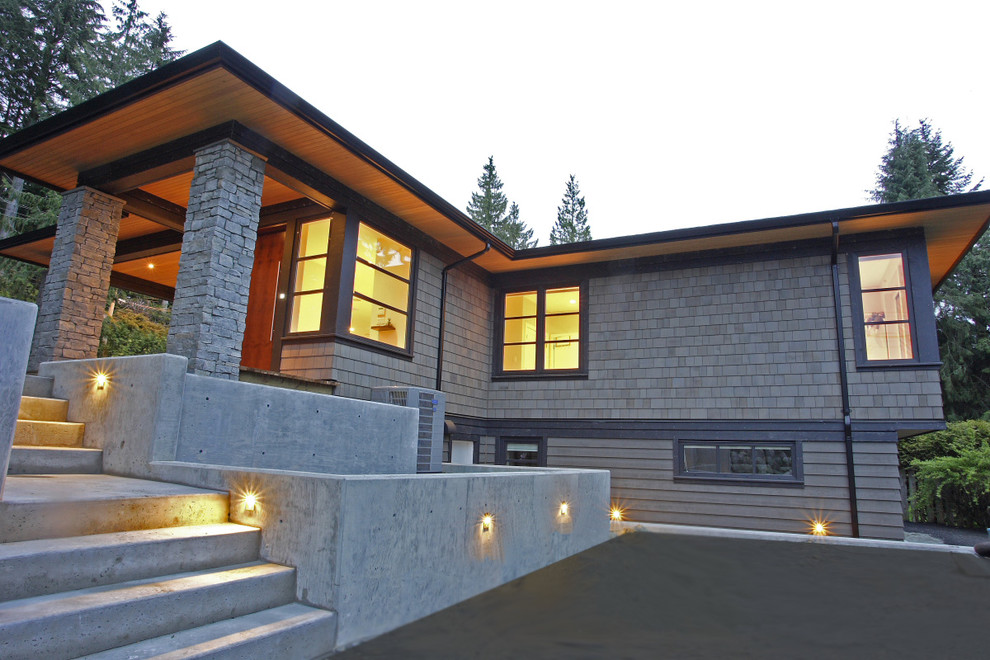 Inspiration for a contemporary house exterior in Vancouver with wood cladding.
