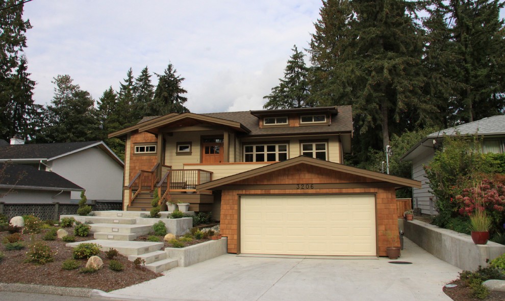 Example of a large classic two-story wood exterior home design in Vancouver