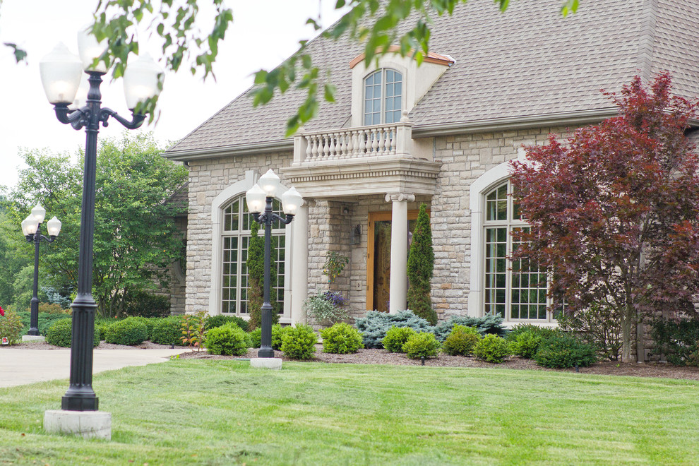 Inspiration for a large gray two-story exterior home remodel in Columbus