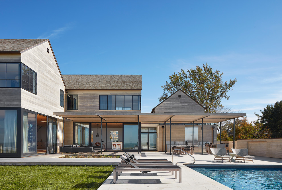 Inspiration for a modern gray two-story wood house exterior remodel in Chicago with a shed roof